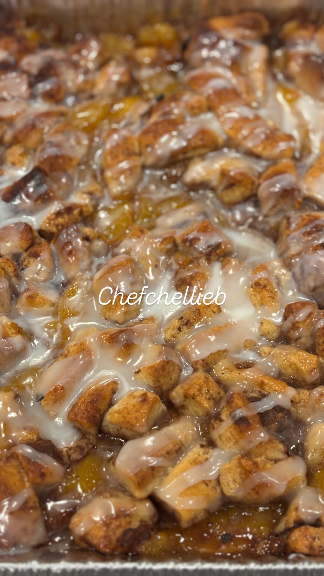 Cinnamon roll peach cobbler with vanilla glaze