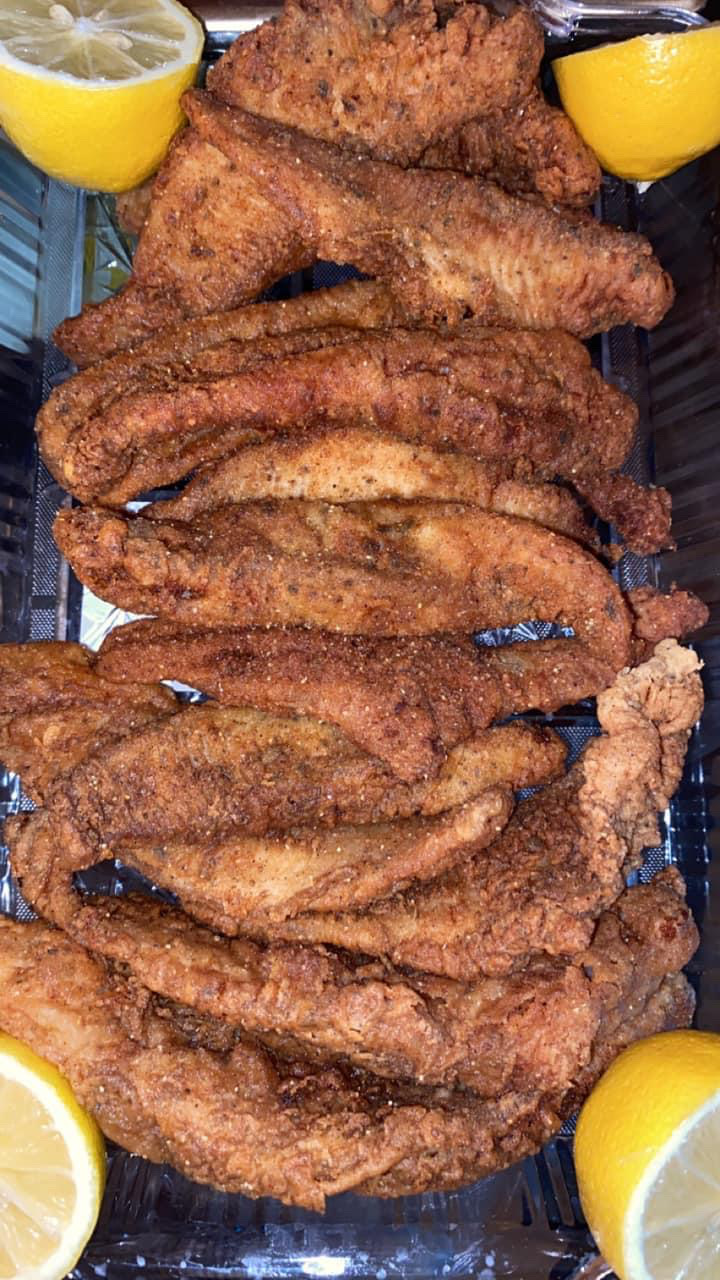 Golden fried fish platter with lemon